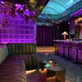 Milky Way Cocktail Bar - Bar and seating area, more seating behind curtain - Cocktail Bars Near Me - Montreal, Quebec Milky Way Cocktail Bar - Bar and seating area, more seating behind curtain - Cocktail Bars Near Me - Montreal, Quebec