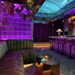 Milky Way Cocktail Bar - Bar and seating area, more seating behind curtain