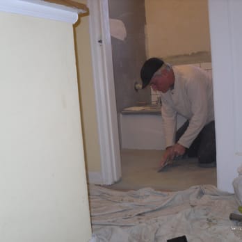 Youngcastle Bathrooms - George finishing up a bathroom floor. - Plumbing Near Me - Shafer, Minnesota Youngcastle Bathrooms - George finishing up a bathroom floor. - Plumbing Near Me - Shafer, Minnesota