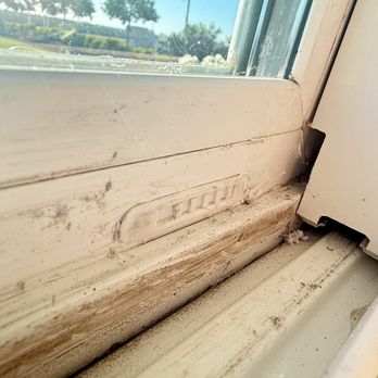 Milgard Windows & Doors - Horrible caulk job. Broken burglar latch. Smeared something all over the white vinyl. - Windows Installation Near Me - Sacramento, California