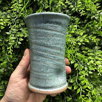 Blackwater Roasters - a hand holding a green pot - Coffee Roasteries Near Me - Seneca, South Carolina Blackwater Roasters - a hand holding a green pot - Coffee Roasteries Near Me - Seneca, South Carolina