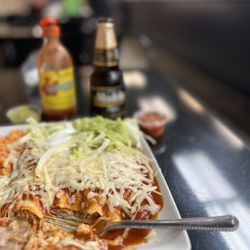 Taqueria Sonora - Chicken enchiladas in a red sauce with Modelo Negra