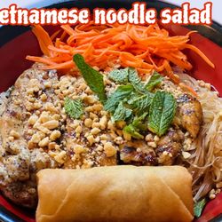 Vermicelli noodle with pickled shredded carrots, romaine heart, fresh herbs, cucumber, bean sprouts, crispy shallots, peanuts, and a spring