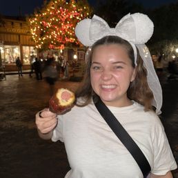 Munching a corn dog at Disneyland Munching a corn dog at Disneyland