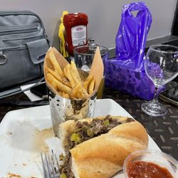 Cuzin's Pub and Grill - Delicious cheese steak sandwich and fries