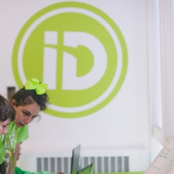 iD Tech Camps - ID Tech Camps - logo and instructor with student