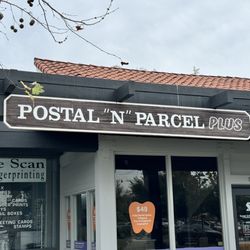 Postal N Parcel Plus - Their sign inside the strip mall.