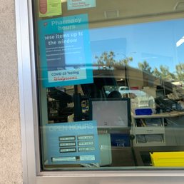 an atm machine with a sign in the window an atm machine with a sign in the window
