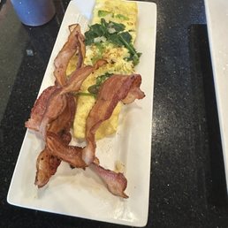 Bacon and a mini omelette with spinach, onion, green peppers and pepper jack cheese Bacon and a mini omelette with spinach, onion, green peppers and pepper jack cheese