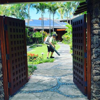 HIL Maintenance - a man with a blower in a tropical garden - Landscaping Near Me HIL Maintenance - a man with a blower in a tropical garden - Landscaping Near Me