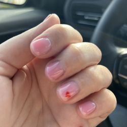 Gaia Nails - Photo of nails with pink builder gel with a red heart on one of the fingers