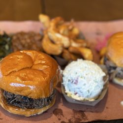 Lewis Barbecue Greenville - Pulled Pork Sandwich, Potato Salad, Brisket Sandwich, Collard Greens, Tallow Fries, Chili Beans.