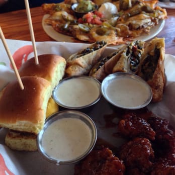 Chili's - Classic nachos in the back. Triple dipper in the front - Bars Near Me - Jacksonville, Florida