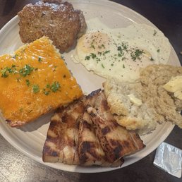 Traditions eggs, cheesy hash, sausage, pork belly, & biscuit. Traditions eggs, cheesy hash, sausage, pork belly, & biscuit.