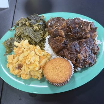 Kim's Cafe - Oxtails with rice, collard greens and Mac and cheese - Breakfast & Brunch Near Me - Savannah, Georgia Kim's Cafe - Oxtails with rice, collard greens and Mac and cheese - Breakfast & Brunch Near Me - Savannah, Georgia