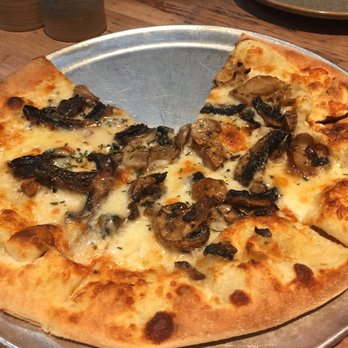 Moku Kitchen - Hamakua Wild Mushroom Pizza with Truffle Oil, White Sauce, Garlic, Parmesan, and Fresh Thyme (minus one slice...) - Cocktail Bars Near Me - Honolulu, Hawaii Moku Kitchen - Hamakua Wild Mushroom Pizza with Truffle Oil, White Sauce, Garlic, Parmesan, and Fresh Thyme (minus one slice...) - Cocktail Bars Near Me - Honolulu, Hawaii