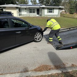 Advanced Towing - Carefully inspecting my car to determine how to best get it on the bed.