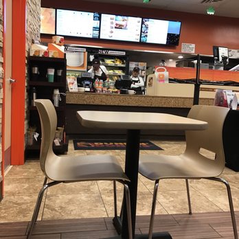 Dunkin' - a table and two chairs in a restaurant - Donuts Near Me - Morris Plains, New Jersey Dunkin' - a table and two chairs in a restaurant - Donuts Near Me - Morris Plains, New Jersey