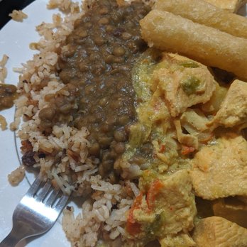 La Cocina De Abuela - Such great food!!!! This is coconut rice with lentils and curried chicken with yucca. - Cuban Near Me - Gainesville, Florida