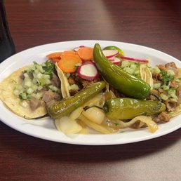 Street tacos; 2 Al pastor, lengua and tripa. Street tacos; 2 Al pastor, lengua and tripa.