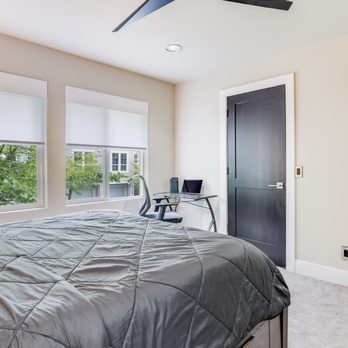 KG Construction - a bedroom with a ceiling fan - General Contractors Near Me KG Construction - a bedroom with a ceiling fan - General Contractors Near Me