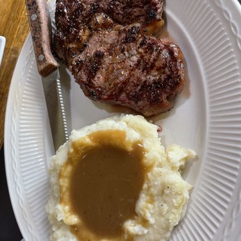 The Beef House - Ribeye and mashed potatoes with gravy - Seafood Near Me - Covington, Indiana The Beef House - Ribeye and mashed potatoes with gravy - Seafood Near Me - Covington, Indiana