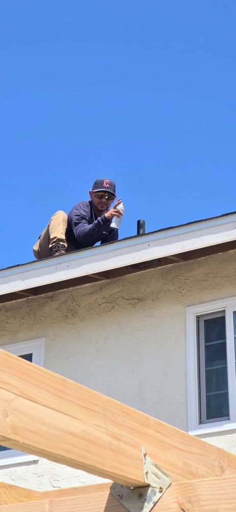 Slide of J&E Roofing Services