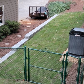 Two Brothers Tree Service and Landscaping - Did a pretty good job on Wall..note difference in grass - Tree Services Near Me