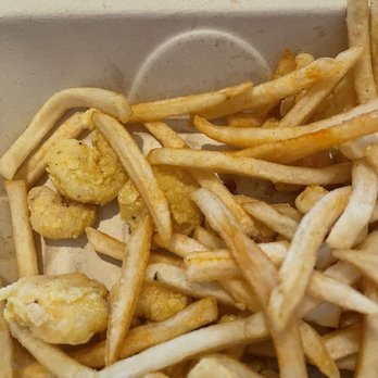 Deckhand Oyster Bar - Pale colored popcorn shrimp and uncooked fries. - Seafood Near Me - Austin, Texas