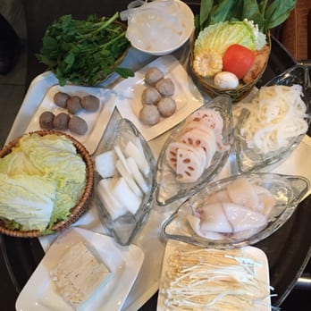 Q Restaurant - Approximate hot pot potions per order. Vegetables, beef balls, squid, tofu, lotus root, gold mushrooms (enoki), etc. - Chinese Near Me - Boston, Massachusetts