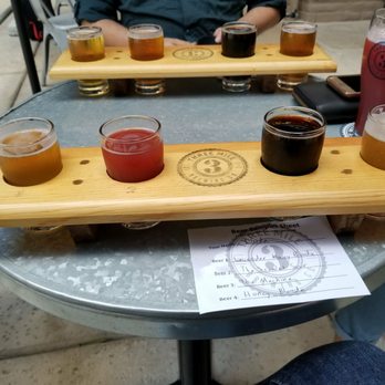Three Mile Brewing - Flight of lavender honey blonde, the scarlet sour, the machine, and honey blonde (LtR) - Breweries Near Me - Davis, California