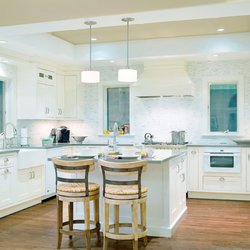 Barbara Feldman Interiors - Overview kitchen with island, white cabinets, honed gray solid surface countertop and pendant fixtures