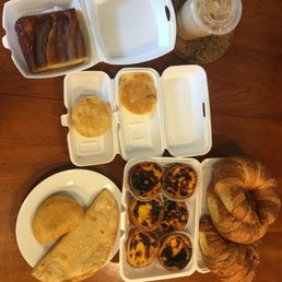 croissants, Portuguese egg tarts, banana cake, iced coffee, orange muffin croissants, Portuguese egg tarts, banana cake, iced coffee, orange muffin