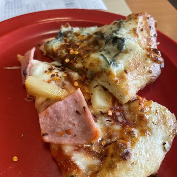 Cicis Pizza - two slices of pizza on a red plate - Pizza Near Me - St. Louis, Missouri