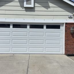 Exterior outside entrance of Safety Garage Door - Traditional long panel with plain light windows - Irvine, California Exterior outside entrance of Safety Garage Door - Traditional long panel with plain light windows - Irvine, California