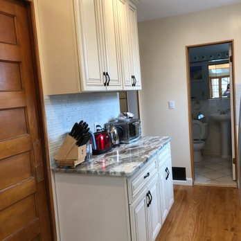2Guys Remodeling - a kitchen with white cabinets - General Contractors Near Me - Staten Island, New York