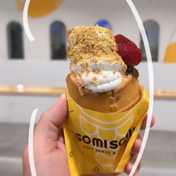 Somisomi - [MY CONE] Nutella stuffed waffle cone! Banana milk soft serve with biscoff, captain crunch, graham cracker crumbs. Strawberry as garnish. - Ice Cream & Frozen Yogurt Near Me - Fullerton, California