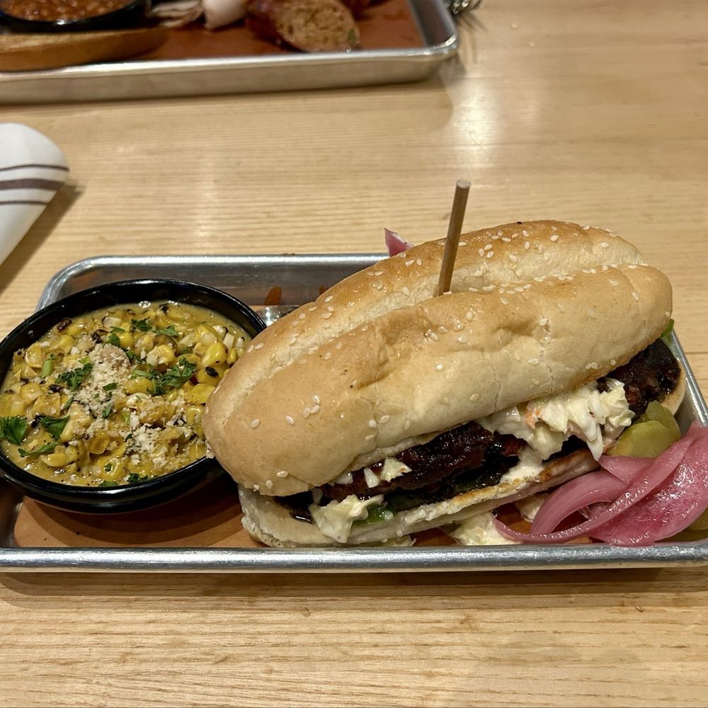 Meat Mitch Barbecue - This is the Mitch Rib sandwich with a side of jalapeño cheesy corn. - Barbeque Near Me - Leawood, Kansas Meat Mitch Barbecue - This is the Mitch Rib sandwich with a side of jalapeño cheesy corn. - Barbeque Near Me - Leawood, Kansas