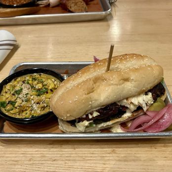 Meat Mitch Barbecue - This is the Mitch Rib sandwich with a side of jalapeño cheesy corn. - Barbeque Near Me - Leawood, Kansas Meat Mitch Barbecue - This is the Mitch Rib sandwich with a side of jalapeño cheesy corn. - Barbeque Near Me - Leawood, Kansas