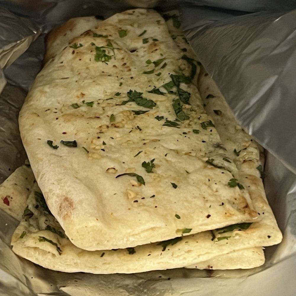 Daddy Ji Finest Indian Cuisine - Garlic naan - Indian Near Me - Claremont, California Daddy Ji Finest Indian Cuisine - Garlic naan - Indian Near Me - Claremont, California