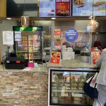 J & J Fish & Chicken - a man standing at the counter - Seafood Near Me - Chicago, Illinois J & J Fish & Chicken - a man standing at the counter - Seafood Near Me - Chicago, Illinois