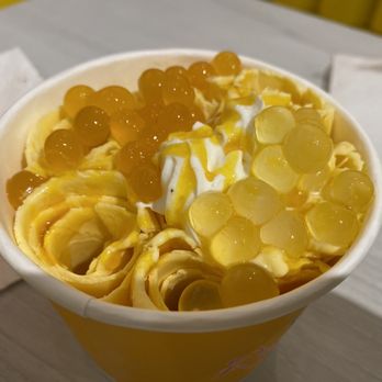 Roll Me Up Ice Cream & Desserts - Mango Madness toppings: Whipped cream, Mango bubbles, Lychee bubbles, & Mango syrup - Ice Cream & Frozen Yogurt Near Me - Markham, Ontario Roll Me Up Ice Cream & Desserts - Mango Madness toppings: Whipped cream, Mango bubbles, Lychee bubbles, & Mango syrup - Ice Cream & Frozen Yogurt Near Me - Markham, Ontario