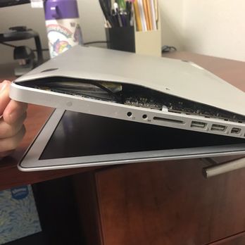 Reno Computer Fix - The battery freeing itself from it's prison. - IT Services & Computer Repair Near Me - Reno, Nevada