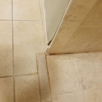 Hampton Inn & Suites Merced - Wallpaper peeling off in the bathroom - Hotels Near Me - Merced, California