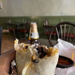 Baja Cali Taqueria & Grill - Not the best picture but this is a carnitas burrito with black beans added guacamole, cheese and sour cream.