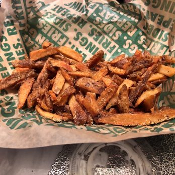 Wingstop - a basket of french fries on a table - Chicken Wings Near Me - San Marcos, Texas