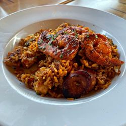 The Side Door Saloon - Jambalaya: Sautéed shrimp, andouille sausage, chicken, green peppers, onions and rice all sautéed with Cajun seasonings.