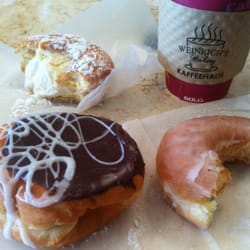 Cream-filled powder, glazed, and Boston cream donuts. And French roast "kaffe"!