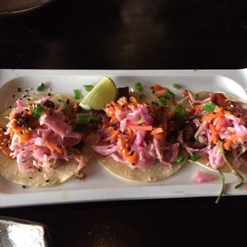 Starfish - now pickled the cabbage or pink veg. taste like sour lemon tacos?beef?can't see it cause a handful of sour veggie look big - Asian Fusion Near Me - Laguna Beach, California