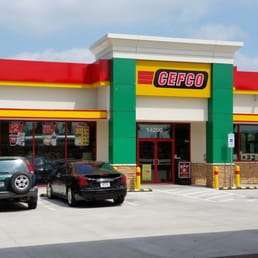 two cars parked in front of a restaurant